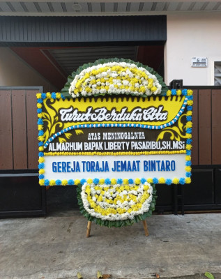 Papan Bunga Duka di Toba